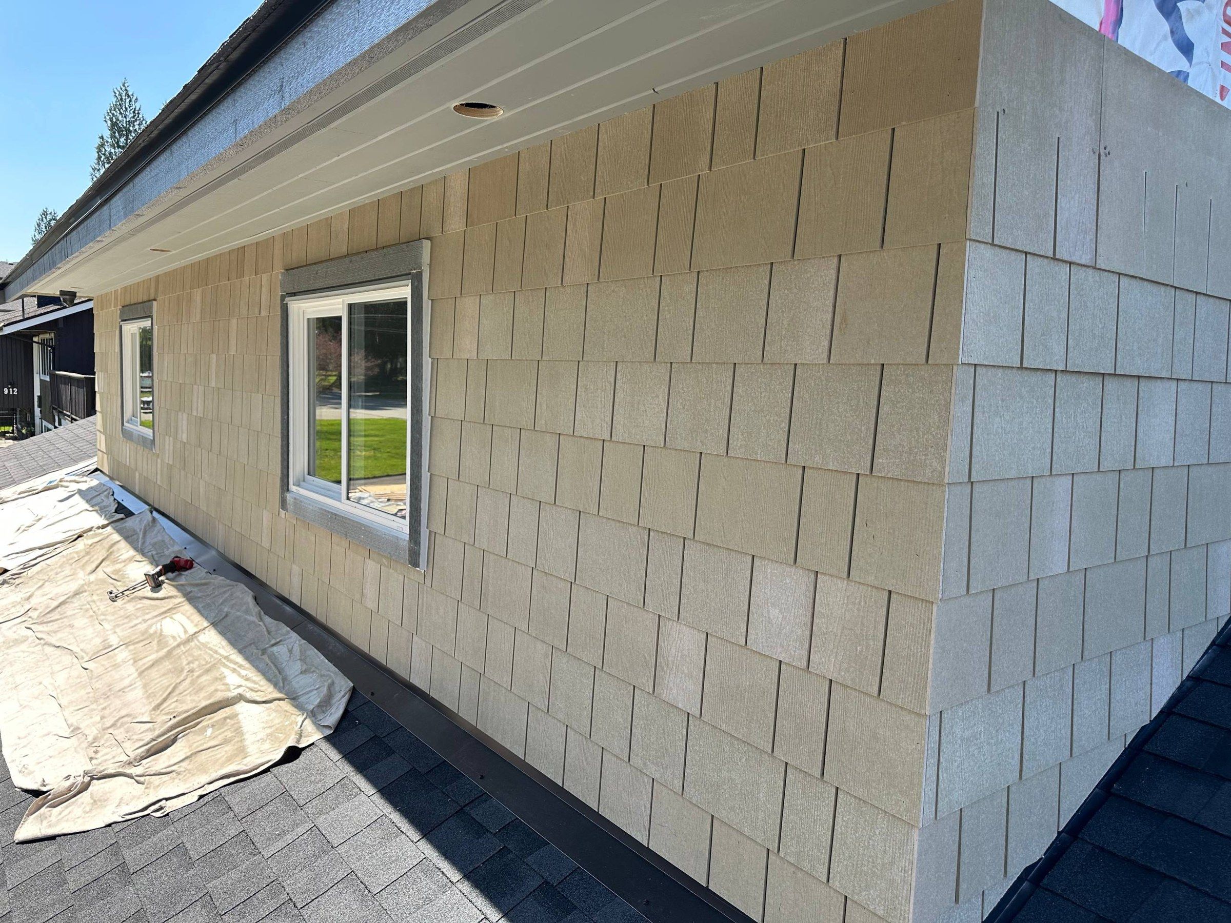 Finished shingle wall with a new window